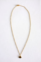 gold stainless steel chain with a small stamped heart charm on white background