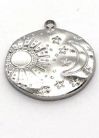 Silver stainless steel charm with sun, moon, and star designs on a white background