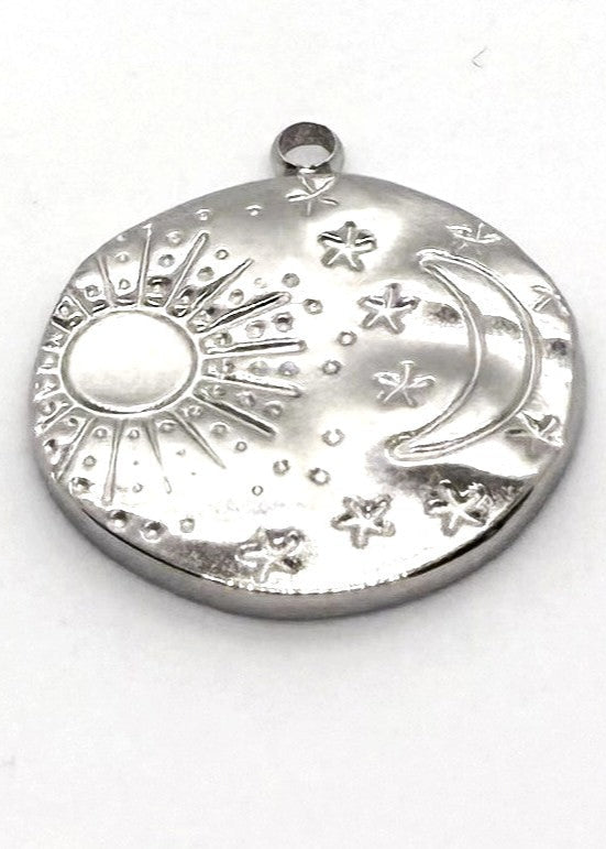 Silver stainless steel charm with sun, moon, and star designs on a white background