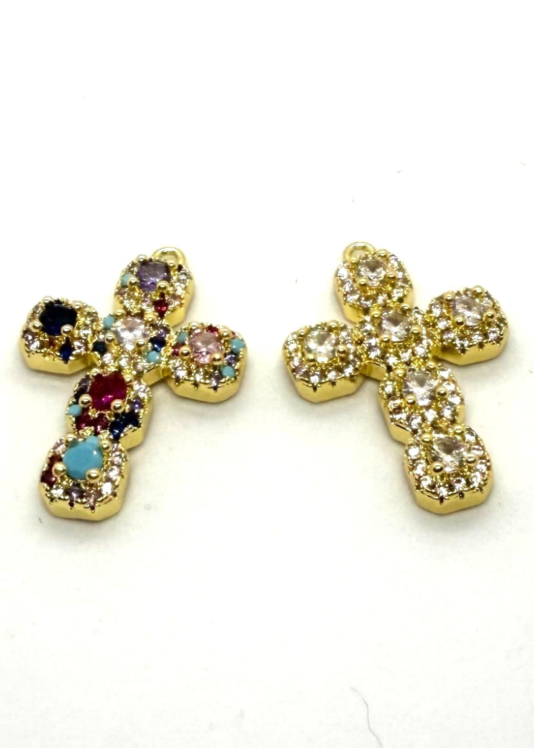 stainless steel Pair of cross-shaped charms with gemstones on a white background