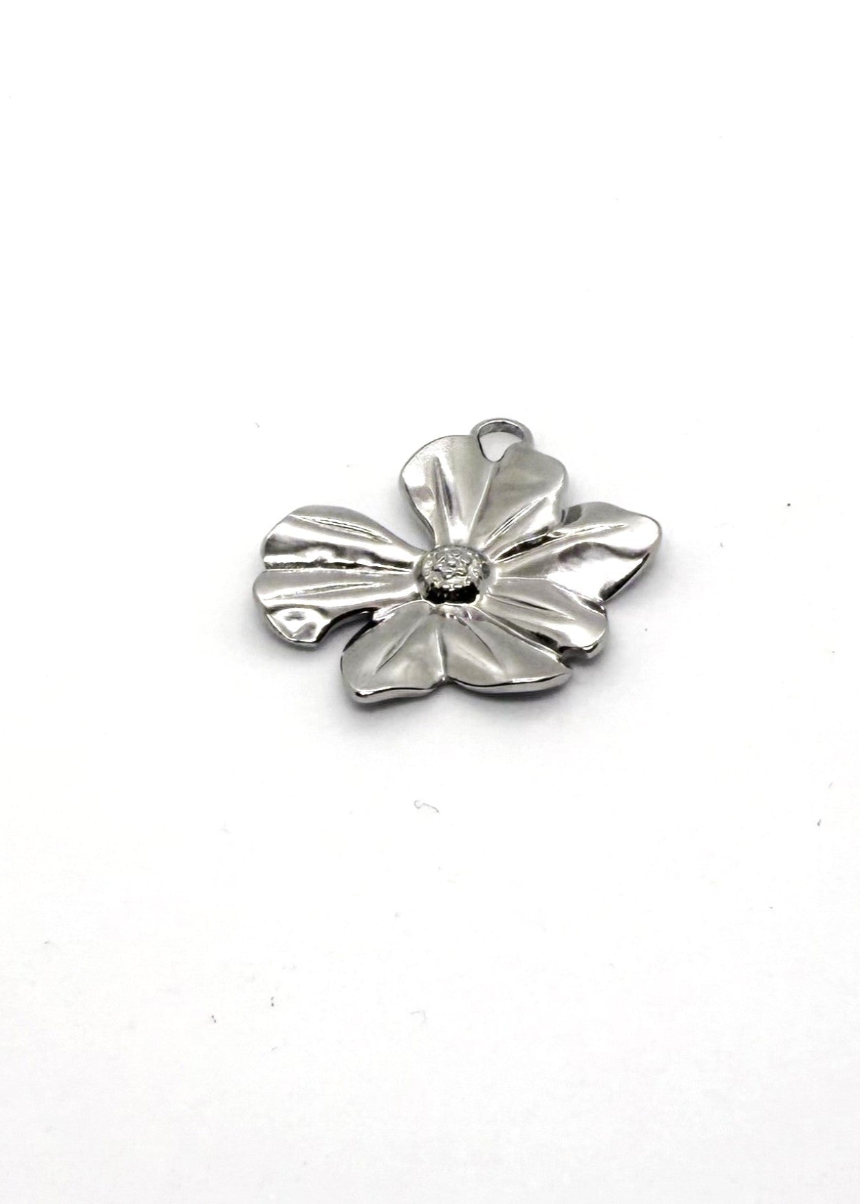Silver stainless steel flower-shaped charm on a white background