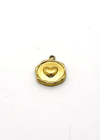 Gold stainless steel locket with a heart design on a white background