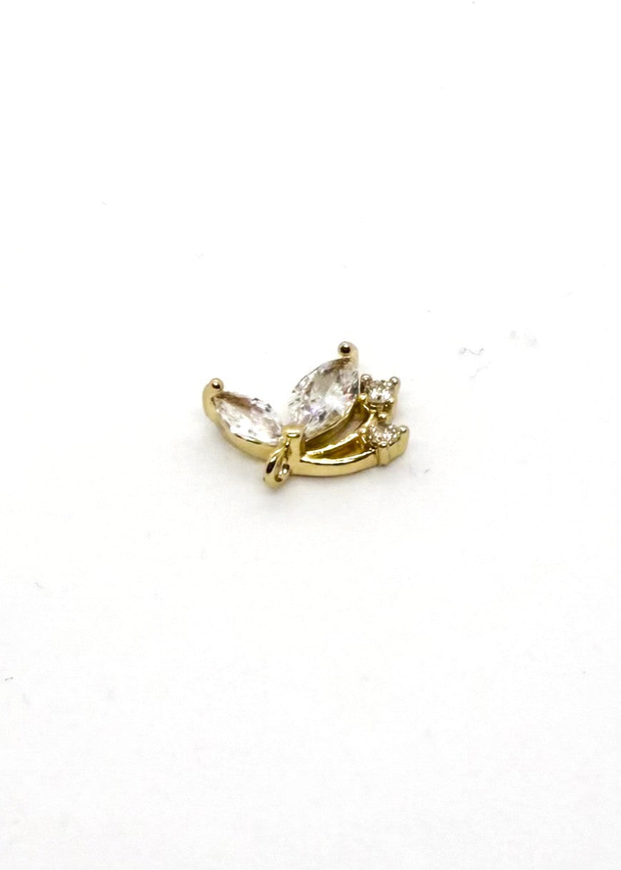 Gold coloured sythentic Zirconia Butterfly charm on white background