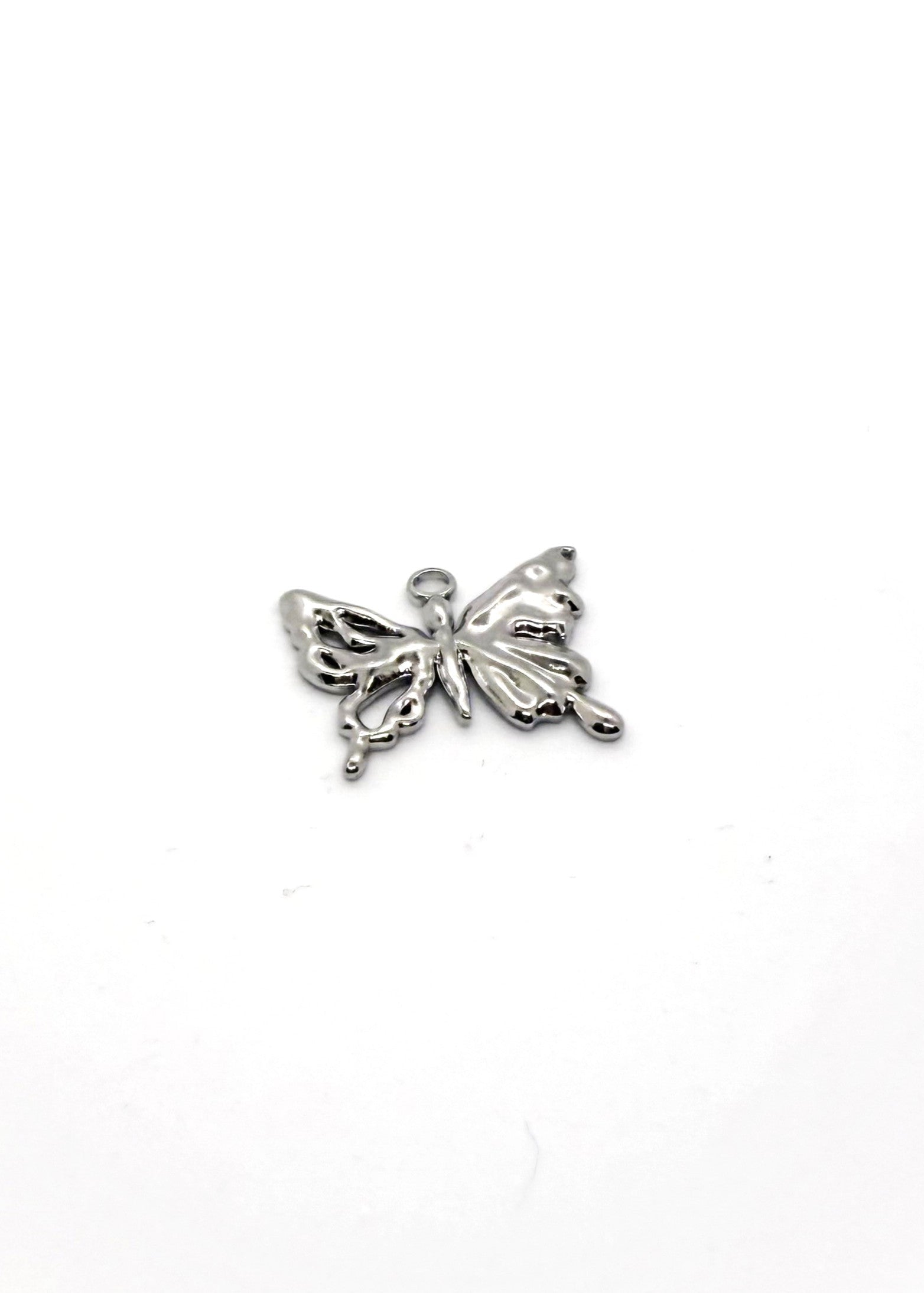stainless steel burtterfly charm in silver on white background