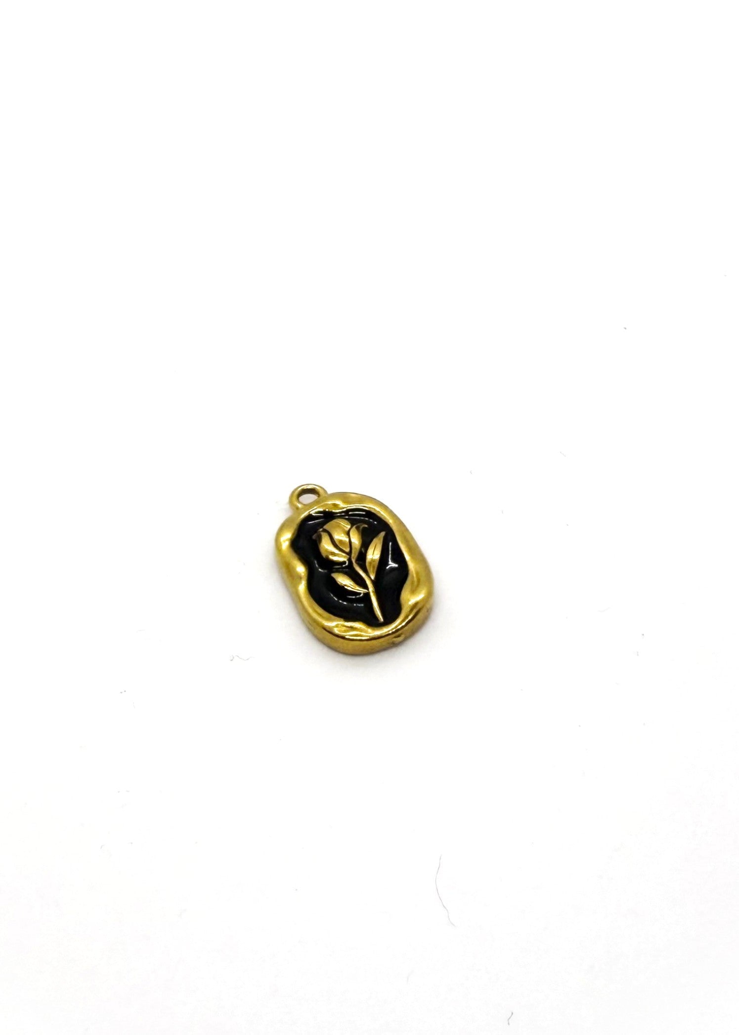 Gold and black pendant on a white background