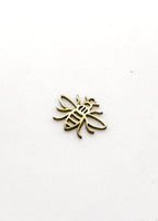 Gold stainless steel bee-shaped charm on a white background