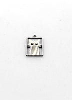 Silver stainless steel cat-shaped charm on a white background