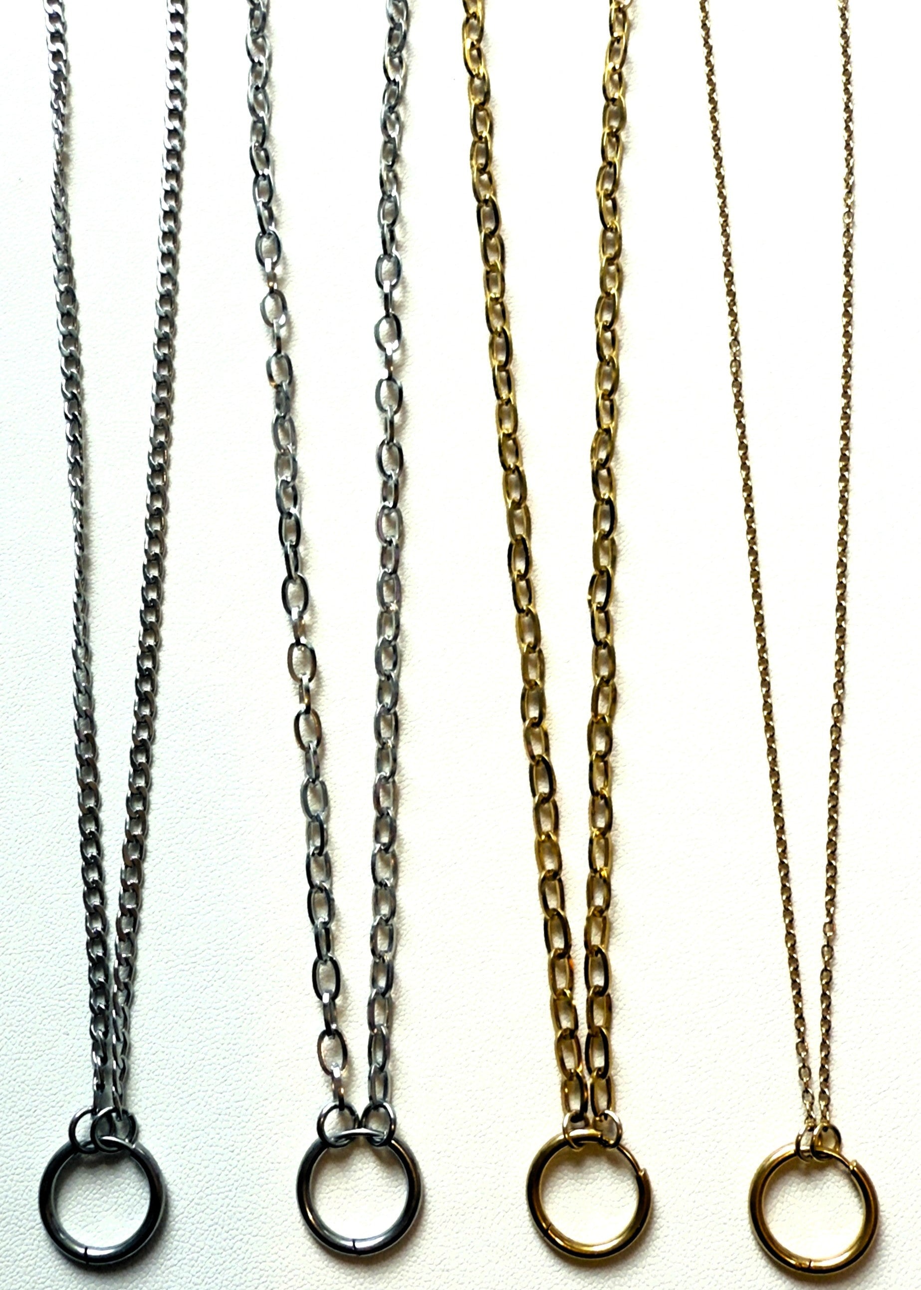 Stainless steel chains on white background, gold and silver