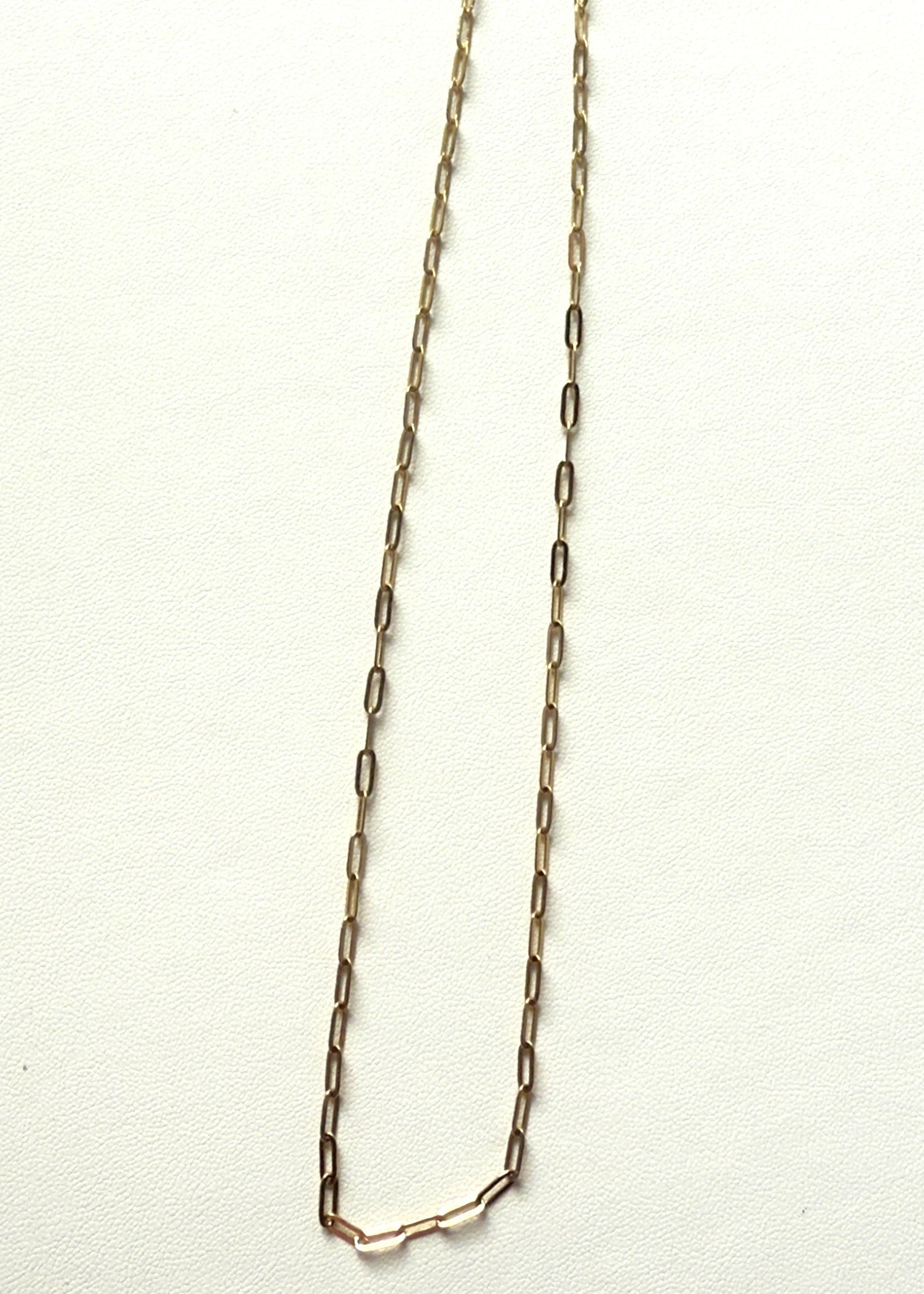 Gold stainless steel chain necklace on a white background