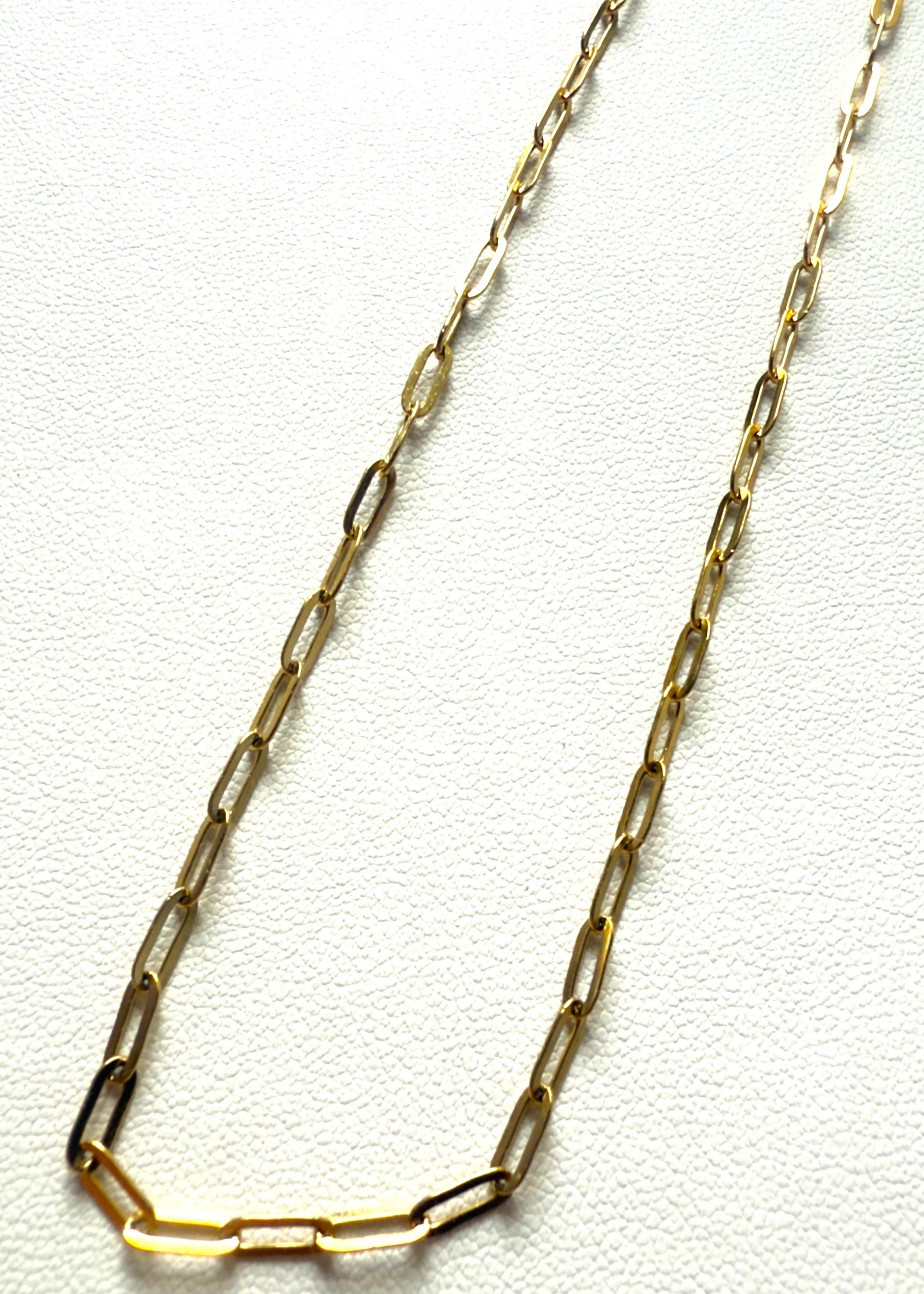 Gold stainless steel chain necklace on a white background